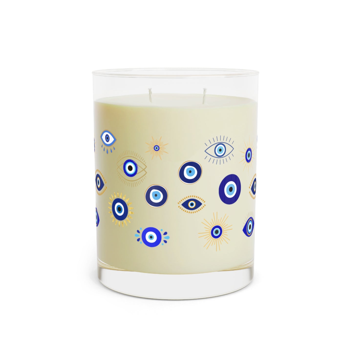 Candle with blue and yellow evil eye pattern on a beige background