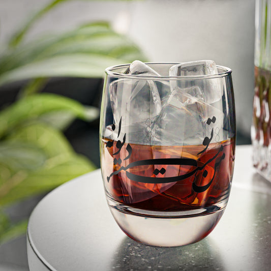 Glass of iced tea with Farsi poem calligraphy text on a blurred background