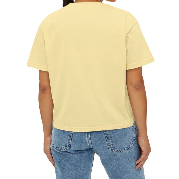 Person wearing a yellow t-shirt with I run on tea, tahdig & questionable decisions text on the chest. 