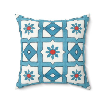 Decorative pillow with blue and white geometric pattern on a white background