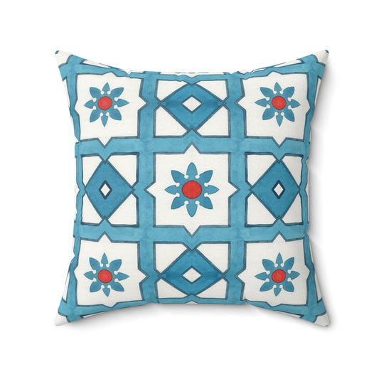 Decorative pillow with blue and white geometric pattern on a white background