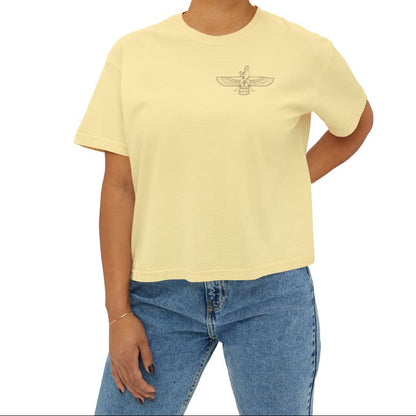 Woman wearing a yellow t-shirt with a Farvahar design on the chest on a white background