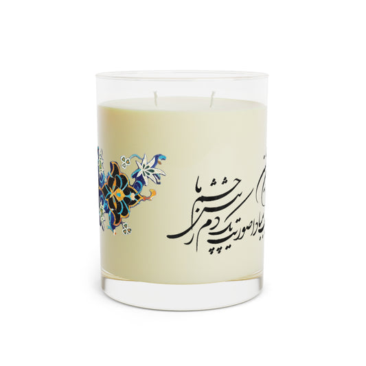 Candle with decorative label featuring Farsi calligraphy and floral designs on a white background