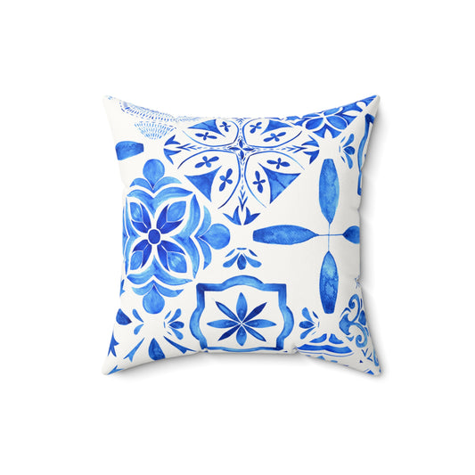 Decorative pillow with blue geometric pattern on a white background