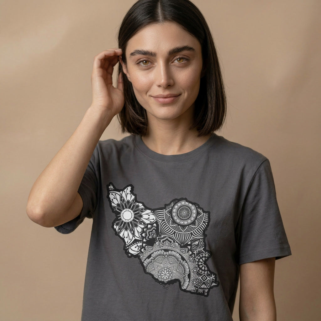 Woman wearing a dark gray t-shirt with a black and white floral design of the Iran Map on a beige background