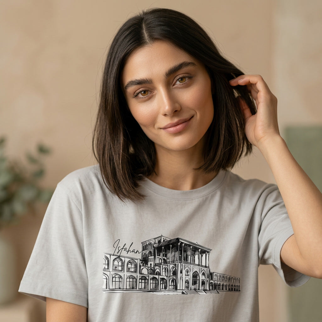 woman wearing a gray tshirt with a graphic of Aali Qapu Palace in Isfahan. 