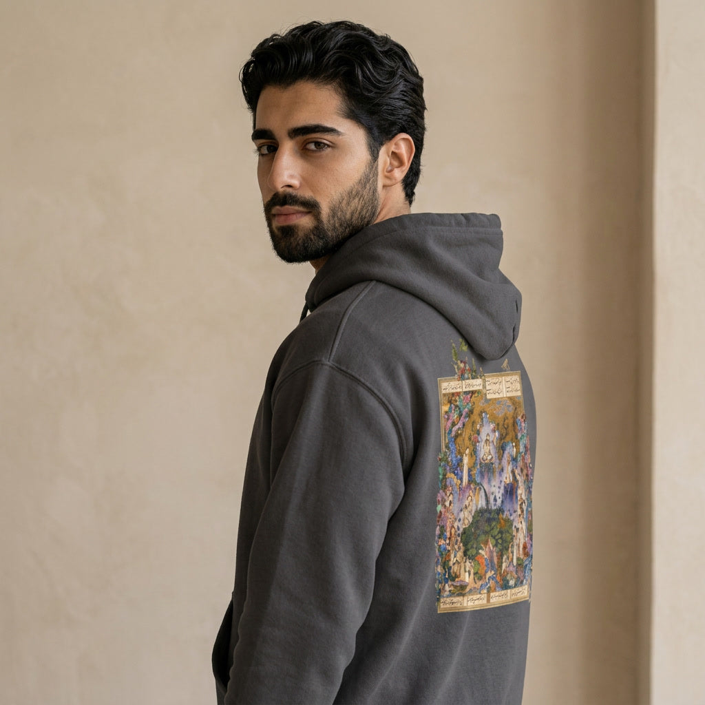 Man wearing a hoodie with Shahnameh art on the back. 