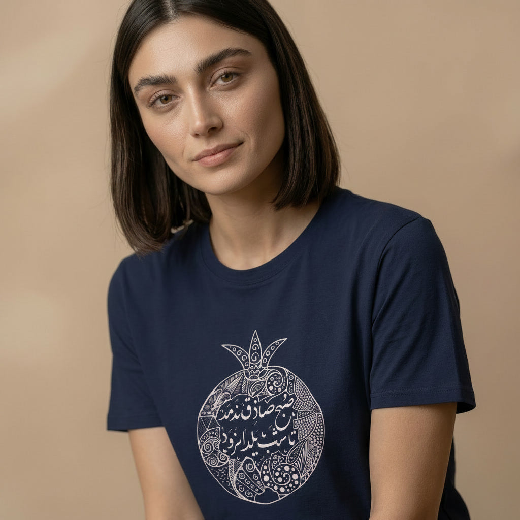 Woman wearing a navy blue t-shirt with a white graphic design on a beige background